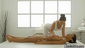 Ebony cutie scissoring lesbo masseuse