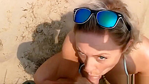 Big breasted blonde milf sucking and fucking on the beach