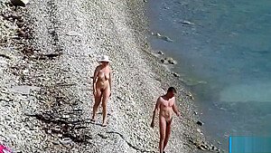 Couple fucked on a public beach while as people walked near