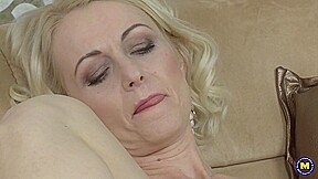 A mature woman in Venice uses a vibrator to stimulate her pulsating clitoris.